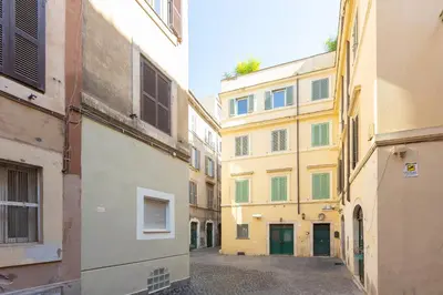 an alley between two buildings in a city at Fabiè Trastevere in Rome