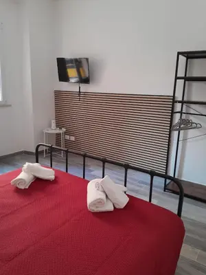 a bedroom with a bed with two towels on it at La Casetta Monteverde in Rome