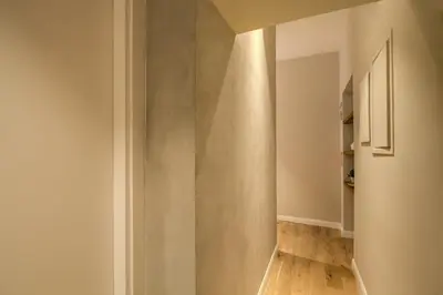 a room with a hallway with a wall at The Spanish Suite Piazza di Spagna in Rome