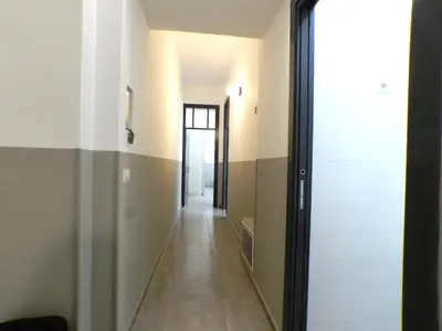 a hallway with a door leading into a room at Giuseppe Apartment in Rome
