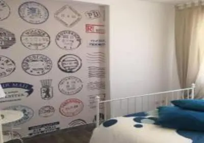 a living room with two beds and a flat screen tv at Domus Romuli in Rome