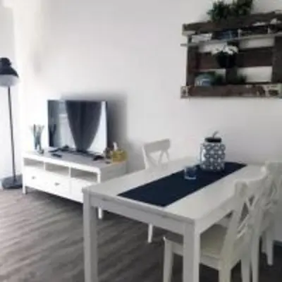 a white table and chairs in a living room at Domus Romuli in Rome