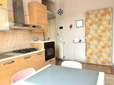 a kitchen with a counter and a stove top oven at Scalo Home in Rome