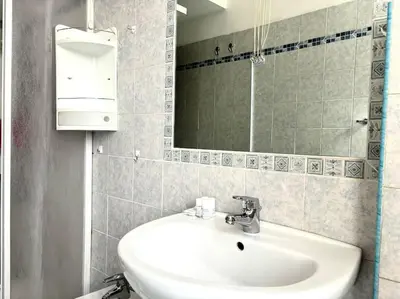 a bathroom with a sink and a mirror at Scalo Home in Rome