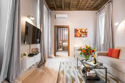 a living room with a couch and a tv at Living Rhome-SpanishSteps in Rome
