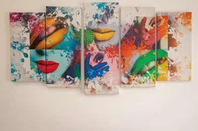 a group of paintings hanging on a wall at Sweet Maya Home in Rome