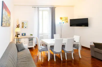 a living room with a white table and chairs at Vespasiano 49 in Rome