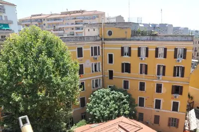 a group of buildings with trees in front of them at MIGDAL Luxury Suites Roma Porta Portese in Rome