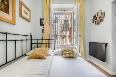 a large white couch in a room with a tv at 