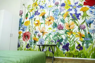 a bedroom with a floral wall mural of flowers at My Dream in Rome in Rome