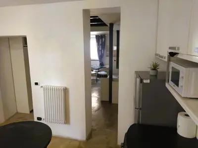 a small kitchen with a radiator in a room at San Cosimato cozy flat in Rome