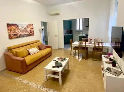 a living room with a couch and a table at Anna's House in Rome