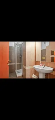 a bathroom with a sink and a shower and a toilet at Casa di Flavio a San Pietro in Rome