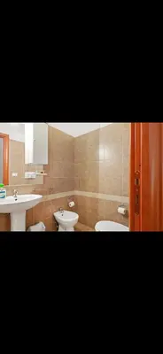 a bathroom with two sinks and two toilets at Casa di Flavio a San Pietro in Rome