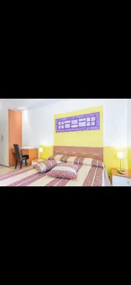 a bedroom with a large bed with pillows on it at Casa di Flavio a San Pietro in Rome