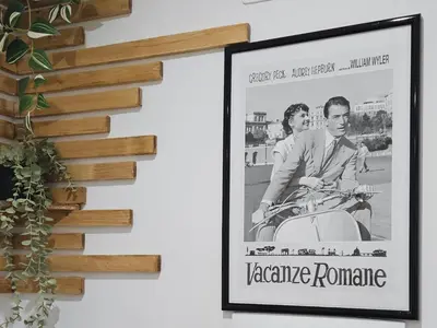 a framed picture of a man riding a motorcycle at Domus green in Rome