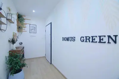 a room with a door with a sign that readsounds green at Domus green in Rome