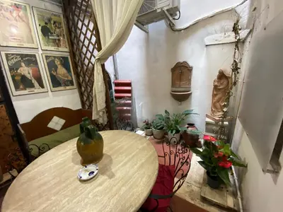 a room with a table and some plants andartifacts at Leonina Luxury Euroform in Rome