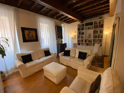 a living room with white couches and a table at Leonina Luxury Euroform in Rome
