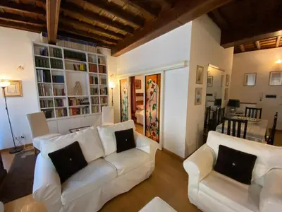 a living room with two white couches and a table at Leonina Luxury Euroform in Rome