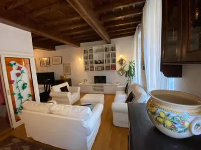 a living room with white couches and a table at Leonina Luxury Euroform in Rome