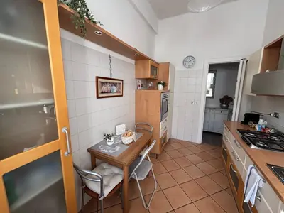a kitchen with a table and a small table in it at Sweet Anna in Rome
