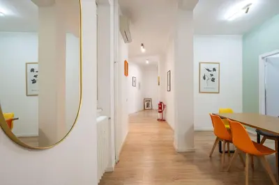 a dining room with a table and a mirror at Monte Sacro apartment for 6 guests Metro B in Rome