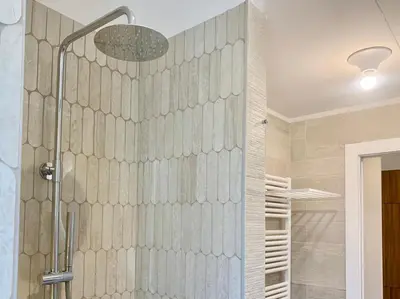 a shower in a bathroom with a glass wall at RomeAsYouLike - Stradivari Charme in Rome