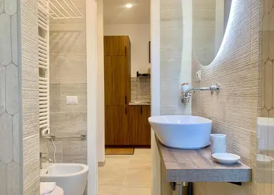 a bathroom with a sink and a toilet and a mirror at RomeAsYouLike - Stradivari Charme in Rome