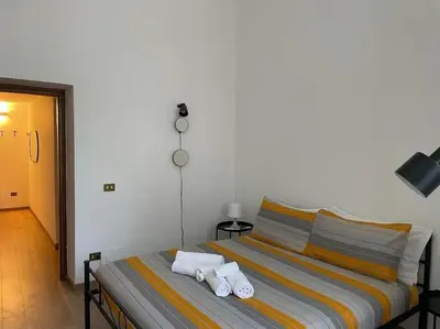 a bedroom with a bed with towels on it at testaccio sei in Rome