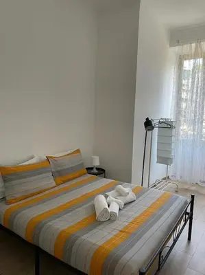 a bed with towels on it in a bedroom at testaccio sei in Rome