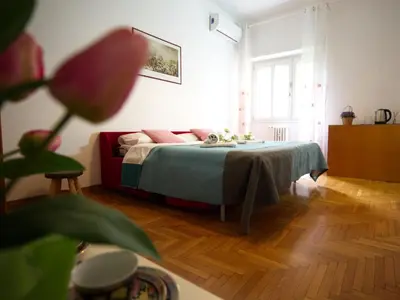 a table with two plates of croissants and a coffee maker at Casa Franciska in Rome
