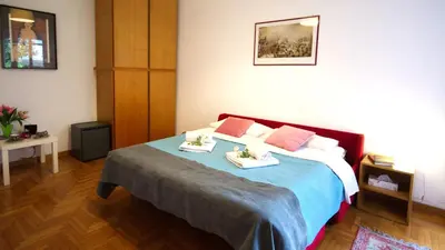 a hotel room with a bed with towels on it at Casa Franciska in Rome