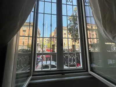 a view of a city from a window at FL Suites - Vatican in Rome