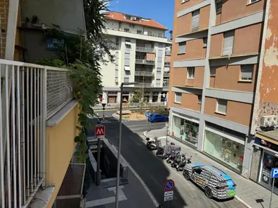 a view of a city street with motorcycles parked next to buildings at Chic&Elegant Retreat in Rome in Rome