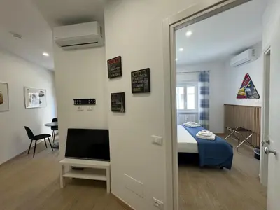 a bedroom with a bed and a television in a room at Chic&Elegant Retreat in Rome in Rome