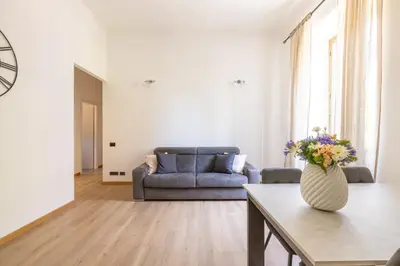a living room with a couch and a table at Elegant Ostiense Suite in Rome