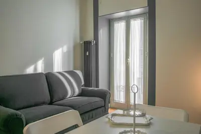 a living room with a couch and a table at Vatican Angels Casa Vacanze in Rome