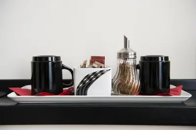 a tray with two coffee mugs on a table at Grammy Suite in Rome