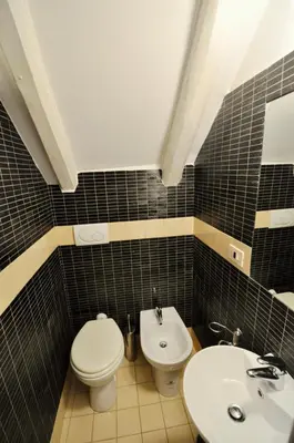 a bathroom with a toilet and a sink at Pantheon Suite in Rome