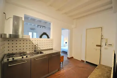 a kitchen with a sink and a stove top oven at Pantheon Suite in Rome
