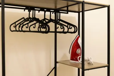 a shelf with a red vase on top of it at Appartamento Scena Vaticana in Rome