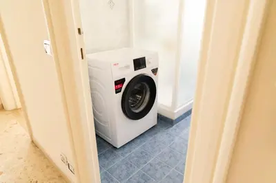 a washer and dryer sitting in a room at Appartamento Scena Vaticana in Rome