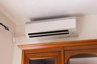 a white wall mounted air conditioner on a ceiling at Appartamento Scena Vaticana in Rome