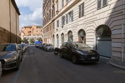 a car parked on a street next to a building at L'atelier in Rome