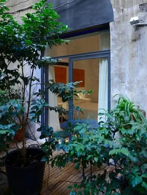 a window of a house with plants in front of it at L'atelier in Rome