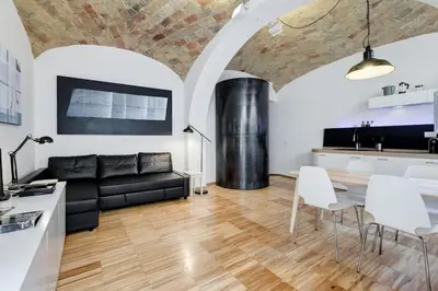 a living room with a couch and a table at L'atelier in Rome