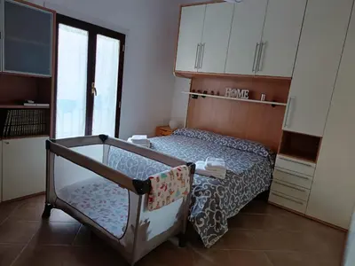 a small bedroom with a bed in a room at Rione Testaccio Apartment in Rome
