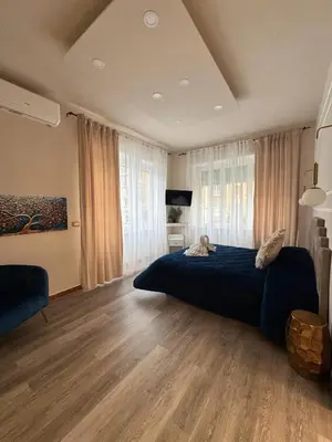 a bedroom with a bed with a cat laying on it at Glint House Prestige in Rome