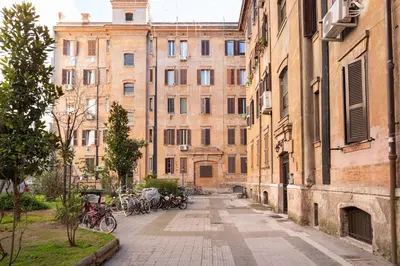 an alley in a city with bikes parked in front of buildings at Loving Testaccio in Rome